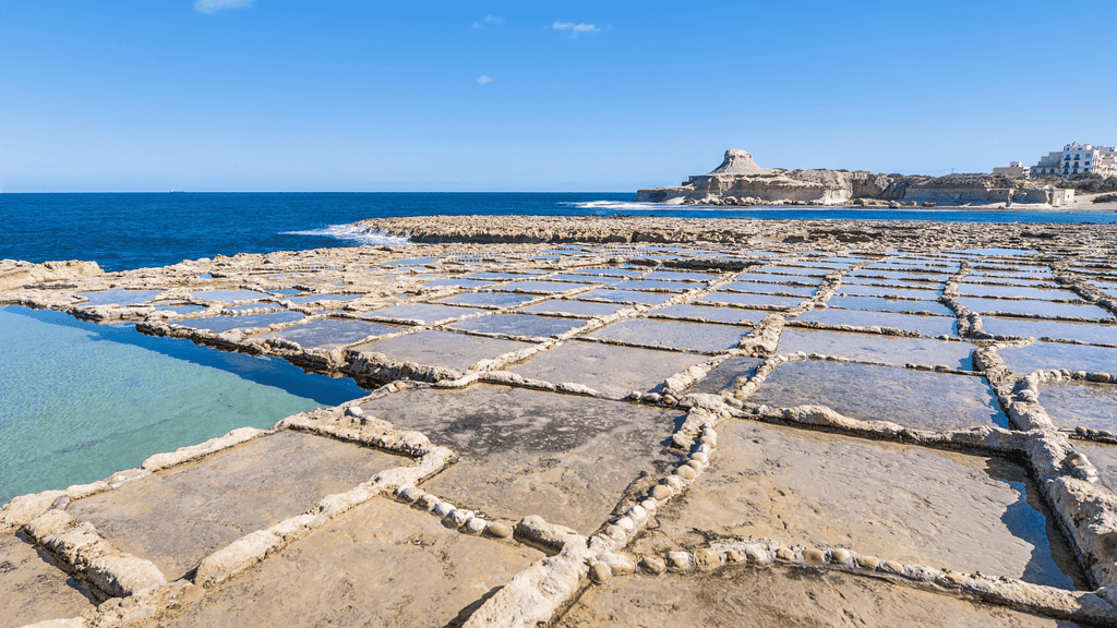 Xwejni Bay Salt Pans. Squares carved into the limestone rock beach,