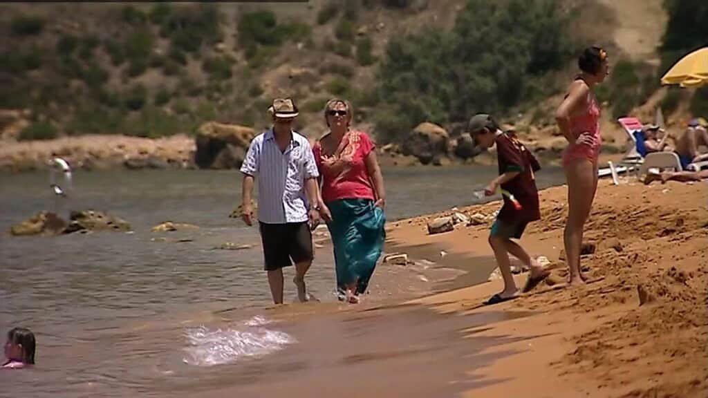 Steve McDonald and Eileen Grimsby on Ramla Beach, Gozo.