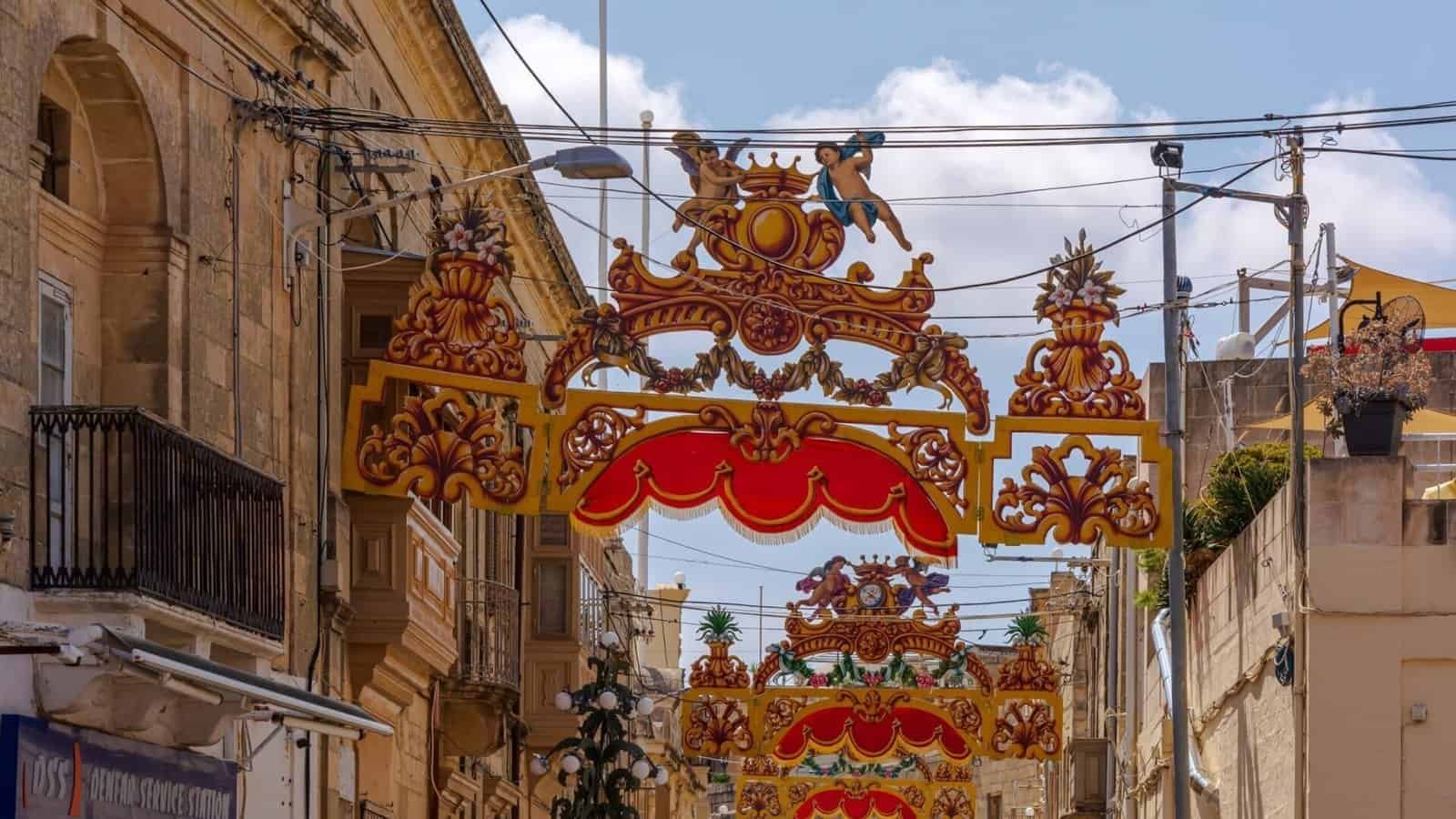 Traditional Maltese Feast streamers (pavaljuni) in red and gold.