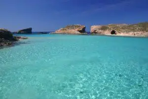 Blue Lagoon, Comino. Crystal blue waters surrounded by limestone shores.