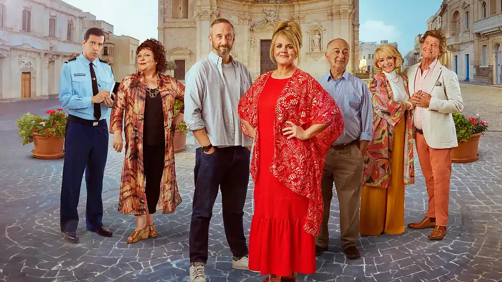 The cast of The Madame Blanc Mysteries pose in front of Gharb parish church.