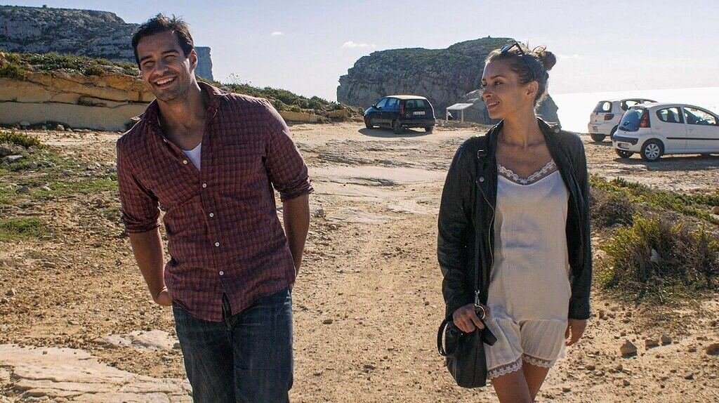 Vincent, Greg Audino, and Ariadna Cabrol, Annalisa, walk through the car part at DWerja Bay.