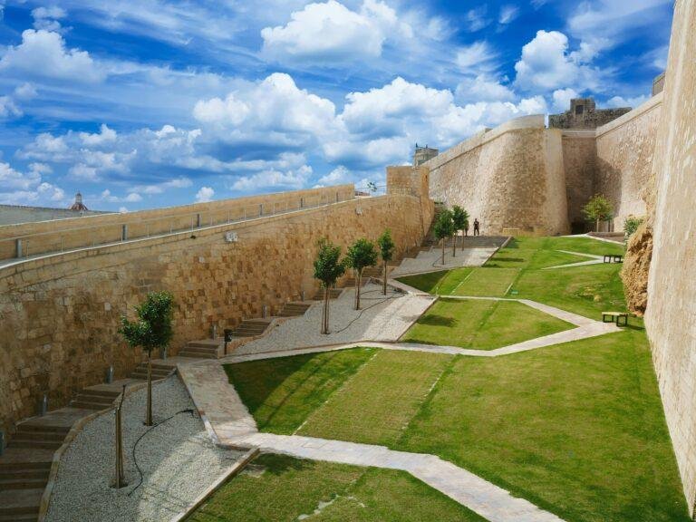 The Ditch, Victoria Citadel, Green grass and trees with an angular path.