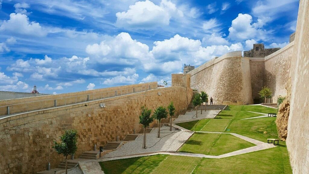The Ditch, Victoria Citadel, Green grass and trees with an angular path.
