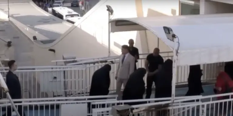 A group of women, dressed in burkhas, exciting the Gozo Channel Ferry.