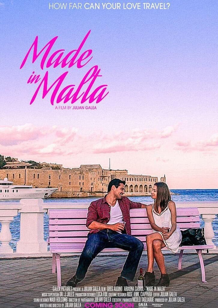 A romantic moment between a man and woman sitting on a pink bench by the seaside in Gozo, Malta, with stunning coastal views.