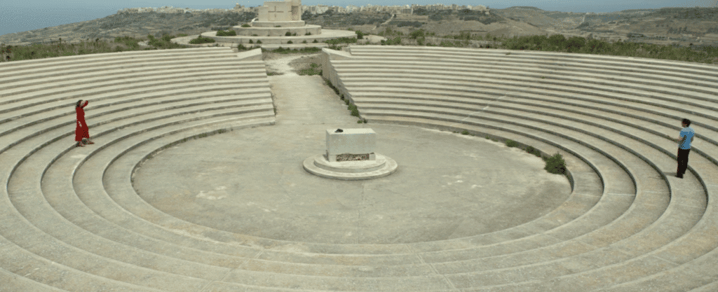 An amphitheatre with a stone alter in centre.