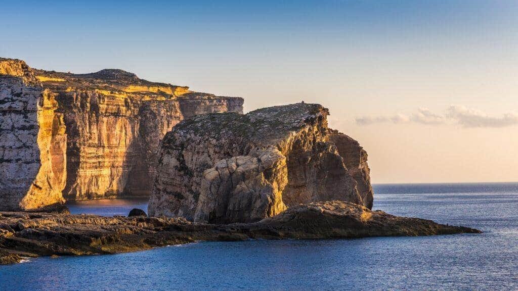 The stunning coastal Fungus Rock formation at sunset.