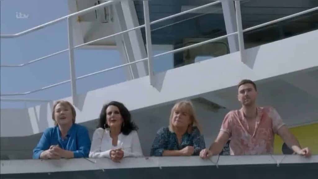 Group of people on the balcony of the Gozo Channel Ferry.