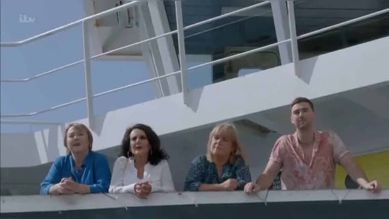 Group of people on the balcony of the Gozo Channel Ferry.