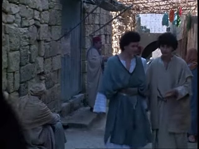 Traditional Maltese people in historic village scenes on Gozo island.