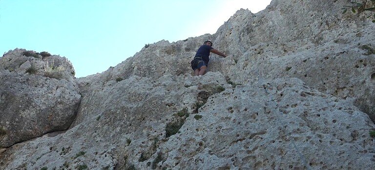 Paddy climbing limestone cliffs