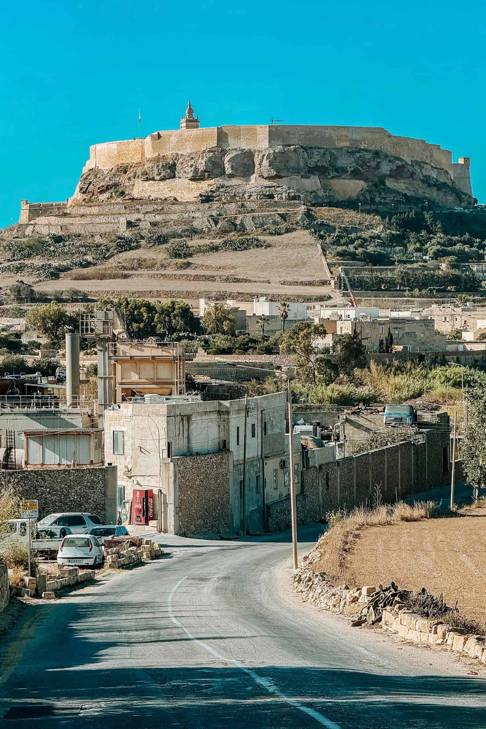 Scenic view of the Citadella fortress in Victoria, Gozo, Malta, under a clear blue sky.