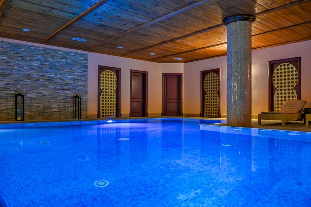 Serene indoor pool with blue tiles